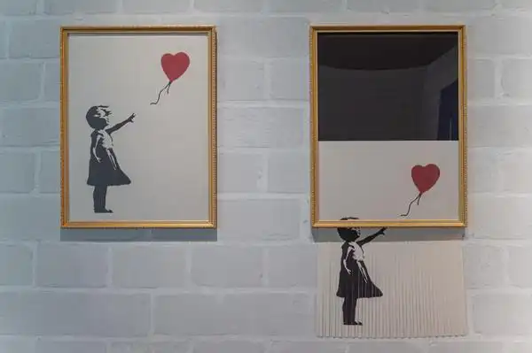 banksy自毁作品「气球女孩」的画面在台复刻重现.