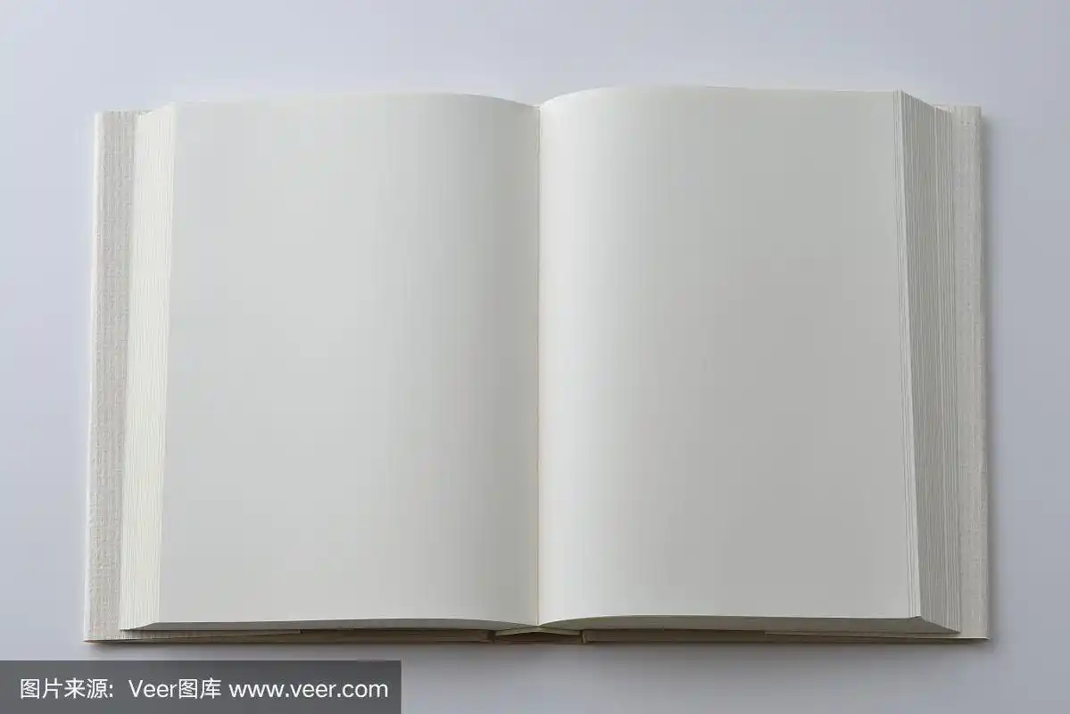 翻开的书的空白页,封面在白色背景上