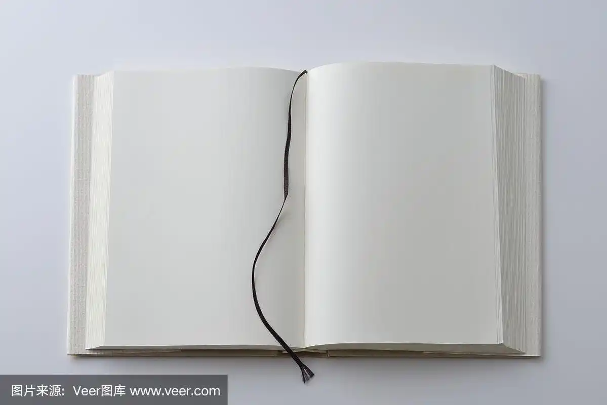 翻开的书的空白页,封面在白色背景上