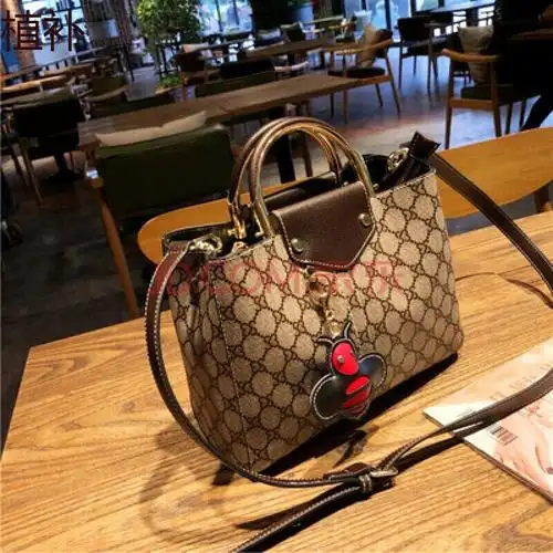 官方旗舰店酷奇女包经典款单肩斜挎女包旗舰官网提水桶包时尚轻奢品牌