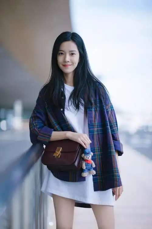 庄达菲率真清新机场街拍照图片46