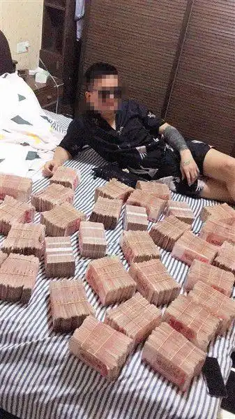 这家人帮诈骗团伙取数千万赃款 铺满床拍视频炫富