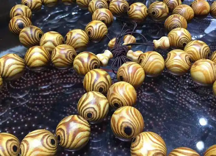 欧吉诗长白山琥珀木手串鬼脸对眼花纹满油全透沉香松明子佛珠手串男瘤