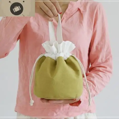 日系帆布手拎包女式抽绳束口袋简约纯色布艺小包水桶包手提化妆包艾狄