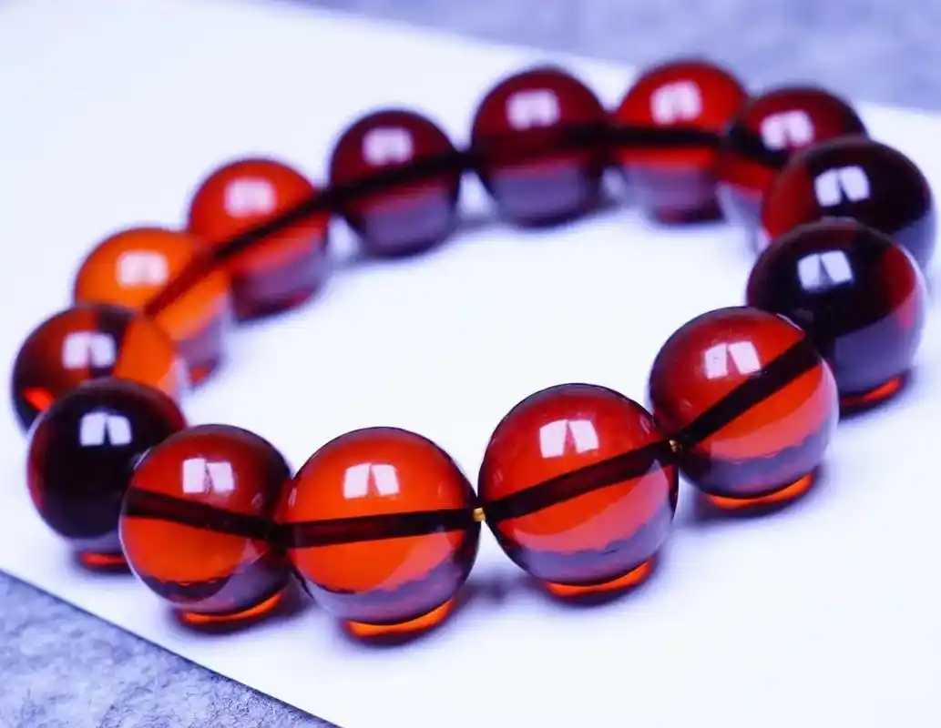 16  血珀手串,重34.4克,晶莹剔透,完美品相 - 抖音